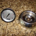 Thermometer and bezel removed from lid