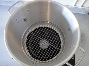 View into Mini WSM of charcoal grate to support heat diffuser