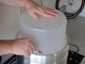 Tracing the cutting outline on bottom of pot