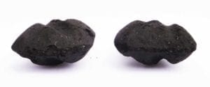 Side view of 2014 Kingsford (left) and 2015 Kingsford (right). There does not appear to be any difference in shape or thickness between the two briquets.