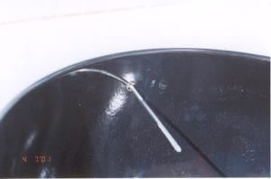 E-clip fastened to candy thermometer inside the lid