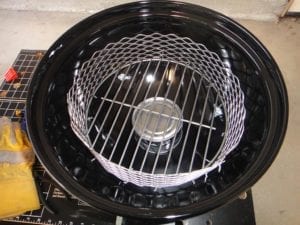 Finished charcoal chamber fastened to charcoal grate