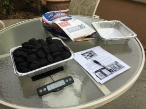 Counting out and weighing 100 Kingsford Original Charcoal Briquets