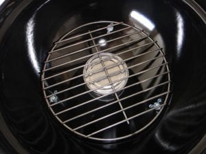 Vent cover installed below charcoal grate