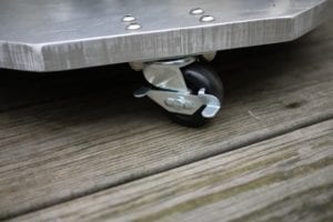 Close-up of casters on aluminum platform