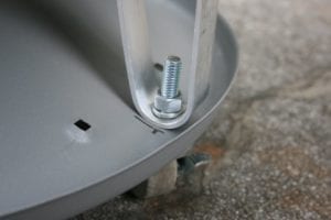 Close-up of leg fastened to satellite dish