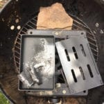 Smoker box on top of cast iron stove