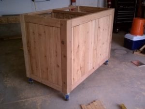 Applying cedar pickets to frame
