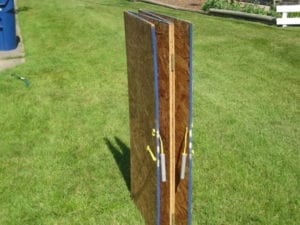 Plywood enclosure folded for storage