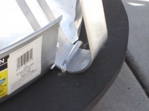 Water heater drip pan cutout and flattened u-bolt fastener