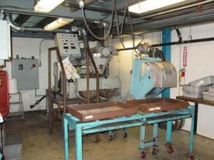 The R&D briquette press. Much larger machines are used to make briquettes at regional production facilities around the United States.