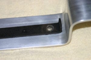 Centering the grill strap on the lid hanger