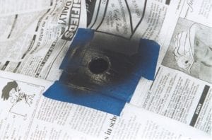Spray painting chips around hole with high temp paint
