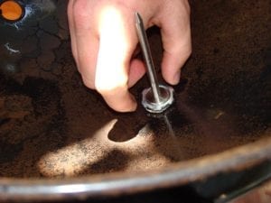 Tightening lock nut inside the lid