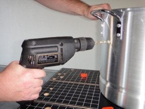 Drilling holes for mounting top cooking grate