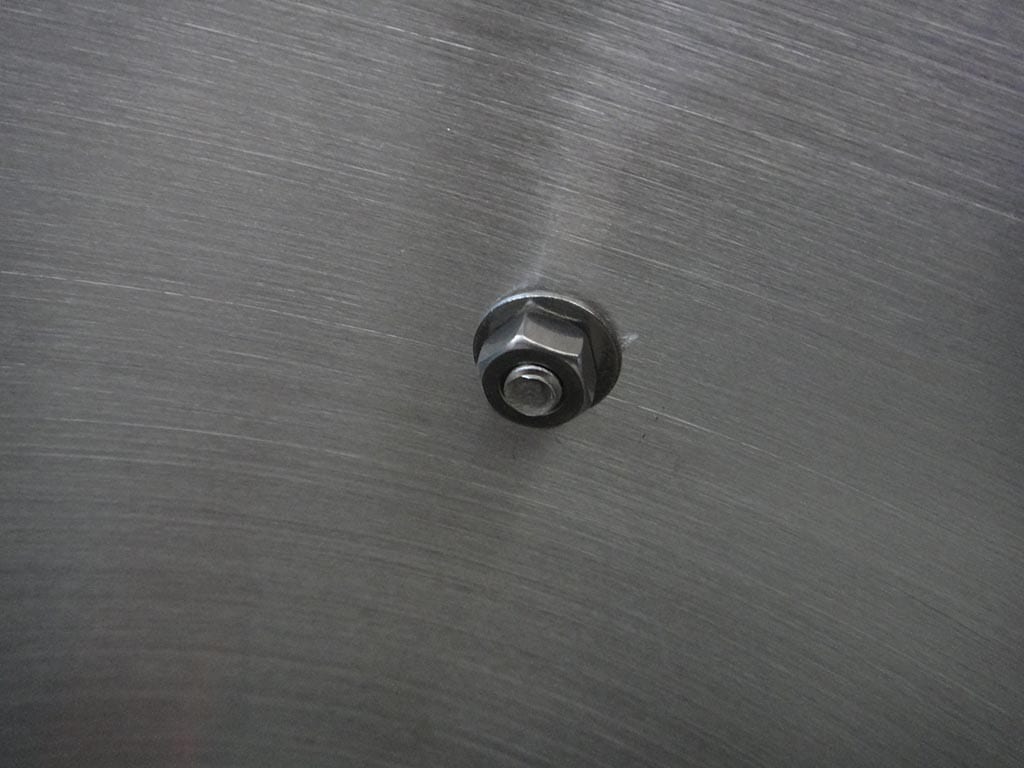 Top grate screw, washer and viewed from inside the pot