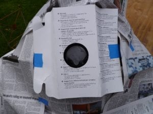 A paint shield is used to feather the spray paint