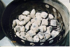 Hot coals spread in charcoal chamber