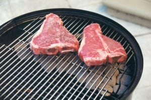 Two Porterhouse steaks go on the grill