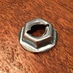 Close-up of Hillman Thread Cutting Nut 7/16 Hex 1/4" Stud