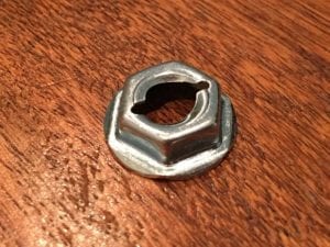 Close-up of Hillman Thread Cutting Nut 7/16 Hex 1/4" Stud