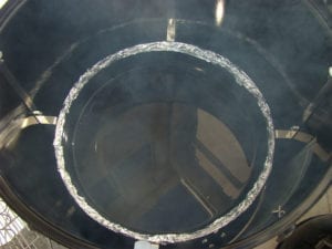 Foiled water pan inside cooker
