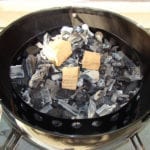 Smoke wood on top of hot coals