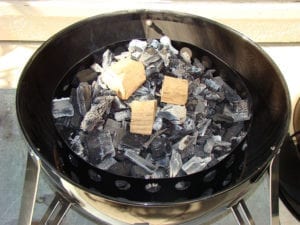 Smoke wood on top of hot coals