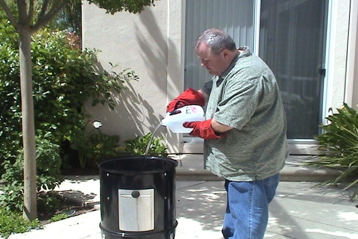Initially filling water pan from above, through bottom cooking grate
