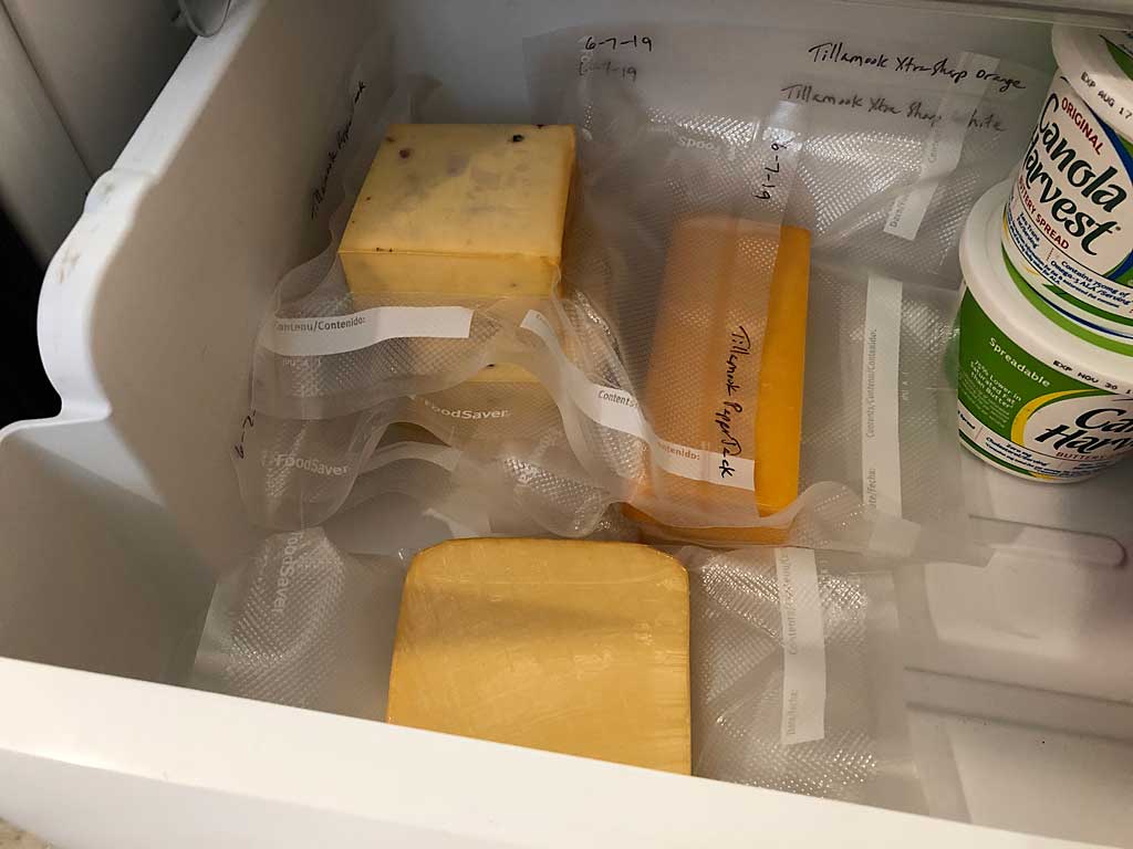 Cheese mellowing in the refrigerator for 2-4 weeks