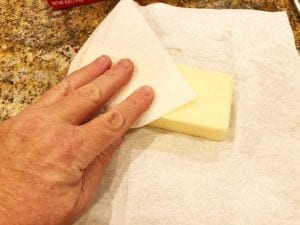 Removing condensation from cheese