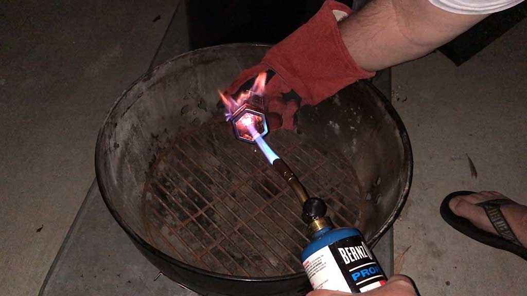 Lighting the pellets with a propane torch