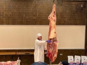 Slicing into ribeye for quality grading