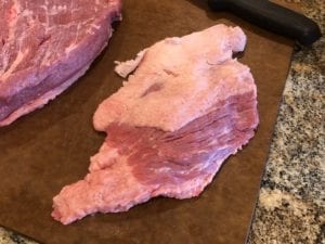 Small portion of brisket point trimmed from brisket flat
