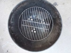 Vents stamped below charcoal grate