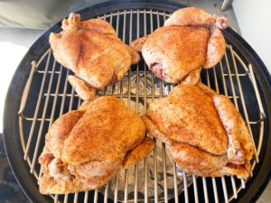 Cornish game hens go into the Weber Smokey Mountain Cooker