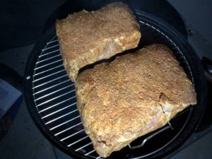 Pork butts on top cooking grate