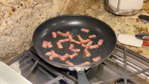Browning bacon pieces for Kansas City Style Cheesy Corn