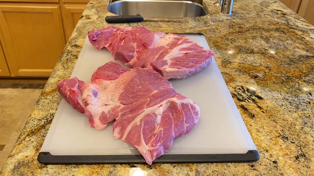 Pork butt split into two pieces
