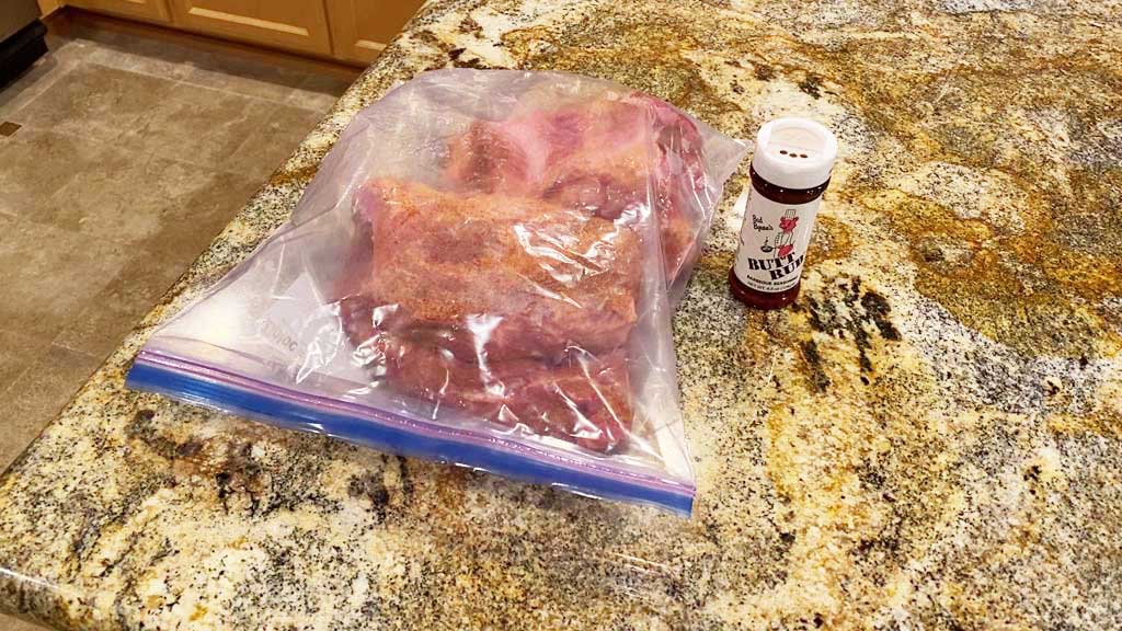Rubbed pork butt ready for refrigerator