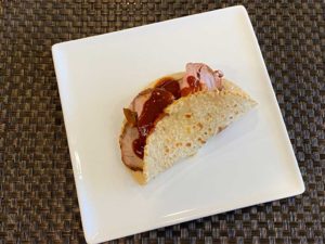 Sliced pork tenderloin with sauce in warm tortilla