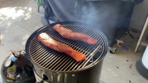 Two pork tenderloins go on the top cooking grate