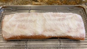 Curing mixture applied to flesh side of salmon