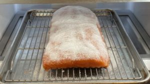 Salmon curing uncovered in refrigerator