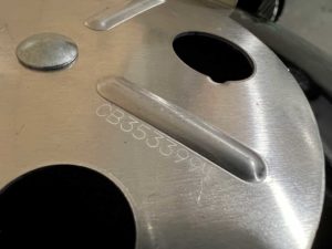 Nine-character date code on WSM 22 lid damper