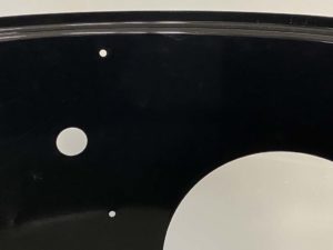 View of grill strap and grommet holes in middle section