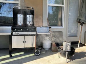 Charcoal chimneys over foil pans