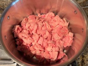Trimmed brisket fat in Dutch oven