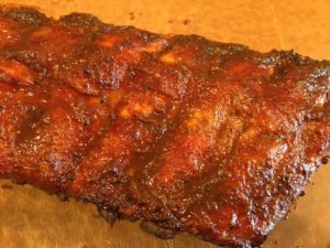 Close-up of sauced baby back ribs