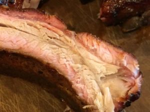 Close-up of baby back rib interior with smoke ring